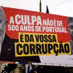 CHEGA AFIXA CARTAZ SOBRE CORRUPÇÃO DURANTE POSSE DE SEGURO E CRITICA PRESENÇA DE JOÃO LOURENÇO